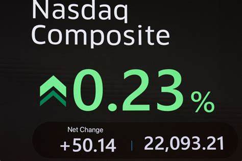 Nasdaq notches record high close, traders look to Fed meeting