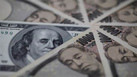 Dollar strengthens versus yen as BOJ strikes cautious stance on rate hikes