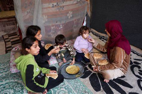 A Gazan mother feeds her twins lentils instead of milk as blockade continues