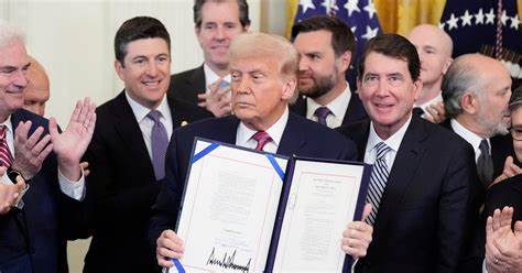 Trump signs landmark crypto bill, the Genius Act, jokes ‘They named it after me’