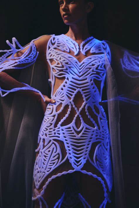Reactive bioluminescent algae illuminate haute couture show in Paris