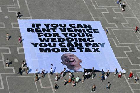 The No Space for Bezos movement: 'One man rents a city for three days? '