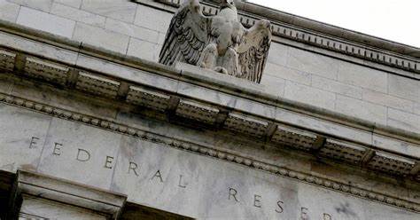 Fed says banks can withstand economic downturn, clears way for dividend hikes