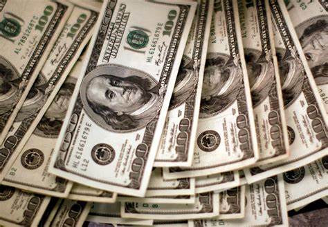 Morning Bid Americas: Dollar plunges as Trump pummels Powell
