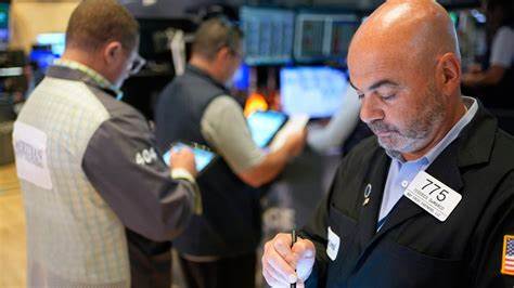 Wall Street holds near its record amid doubts about Trump's tariffs