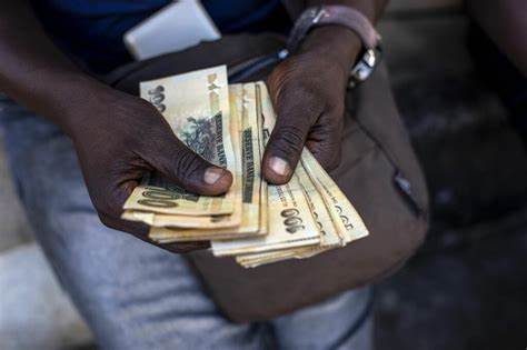 Zimbabwe Lets Currency Free-Fall While It Weighs Gold Standard - Bloomberg