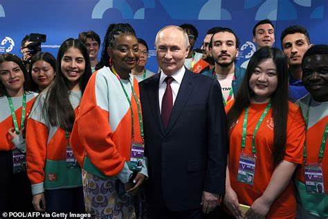 Putin's BRITISH useful idiots: This week an adoring crowd of over 20,000 hand-picked young delegates hailed th - Daily Mail