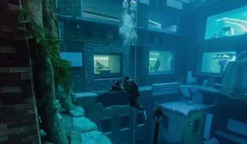 Dubai opens world's deepest diving pool—a sunken city nearly 200 feet under water - CNBC