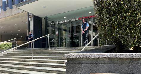 New Zealand keeps interest rates on hold but flags likely cut