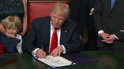 President Donald Trump signs first US crypto regulatory bill into law