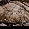 Large ancient Hawaiian petroglyphs uncovered by waves on Oahu