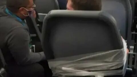 Frontier Airlines passenger who punched window and was restrained by crew and other fliers is charged - Yahoo