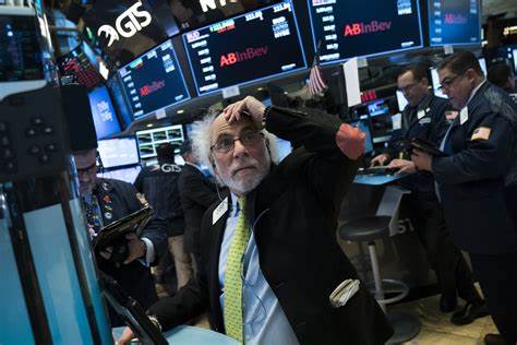 The Latest: Stocks are making wild swings as markets assess the damage from Trump's trade war