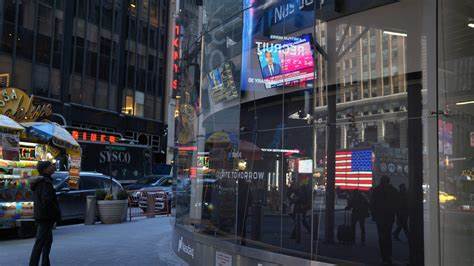 US stocks end mixed, with Dow up after Senate passes tax bill. Trump sinks Tesla stock