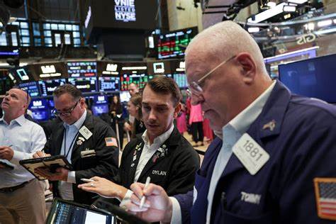 Stocks hit fresh record highs, dollar falls ahead of Fed move