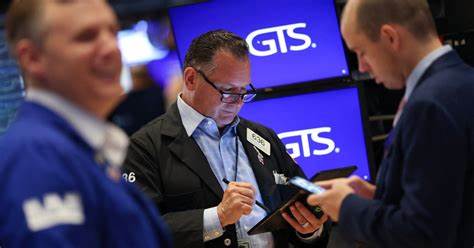 Dow jumps over 300 points, S&P 500 sets new record after strong June jobs report