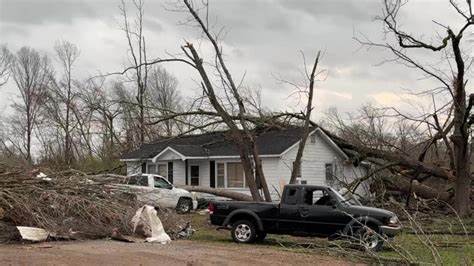Father, son cling together in pre-dawn darkness as tornado ravages 