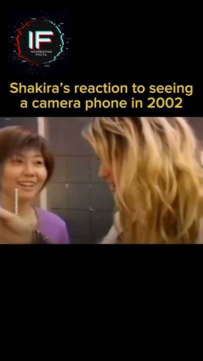 Shakira reacts to a camera phone in 2002