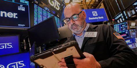 Wall Street rises to more records as Tesla vrooms higher