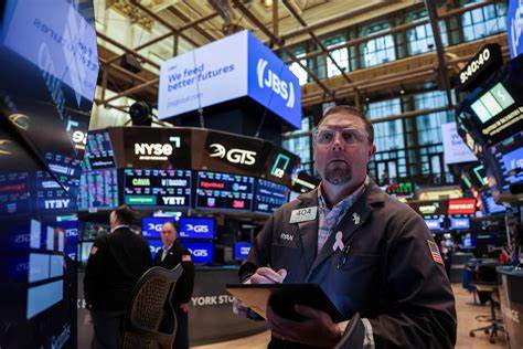 Stocks hit fresh record, dollar weakens to lowest in three years amid Fed worries