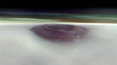 Mars orbiter's first pic of volcano above clouds: twice as tall as Mauna Loa